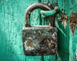 Rusty Padlock On Blue Door ALT